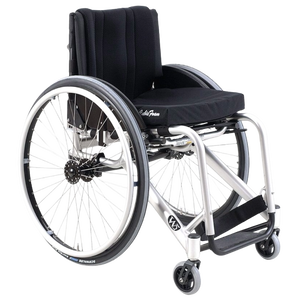 Isolated product view of the Wolturnus W5 K junior active rigid wheelchair featuring a vibrant blue frame, specially designed with a lightweight and durable construction for children and young adults, isolated on a white background.