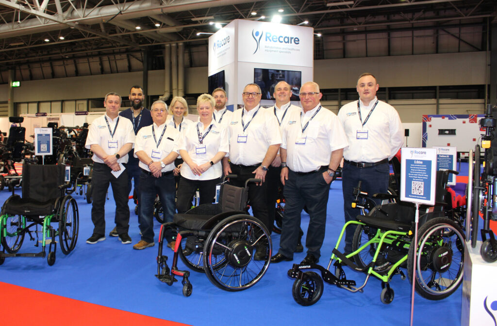 Recare team with wheelchair display at Naidex exhibition