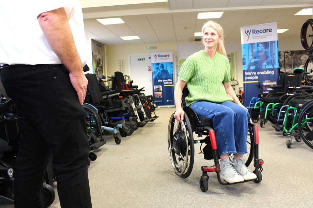 Trying out a wheelchair in a showroom