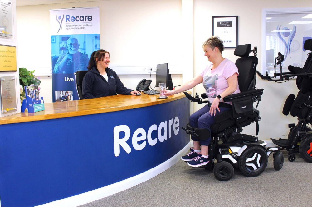 Woman in powerchair at the Recare reception