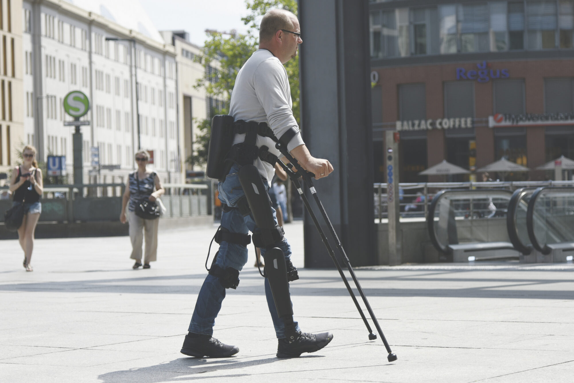 Man walking with exoskeleton technology