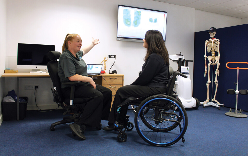 Consulting a wheelchair user on body posture in a seating clinic