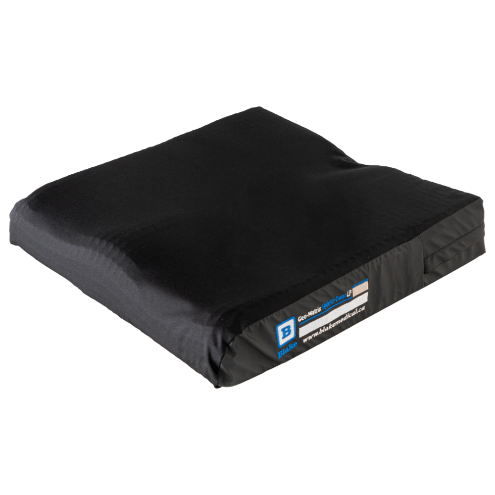 A high-resolution top-down product view of the Blake Medical Geo-Matrix Hybrid Deep Low Profile cushion with all covers removed, isolated on a white background. This image provides a clear view of the clear/white dry-polymer "Pillow Top" gel layer, showing the consistent grid-like structure across the entire surface. The perspective highlights the deep rear immersion well for pelvic stability and the anatomically contoured leg troughs at the front, demonstrating how the 1-inch thick gel topper conforms to the underlying 2-inch multi-density foam base to provide maximum pressure redistribution in a 3-inch total profile.