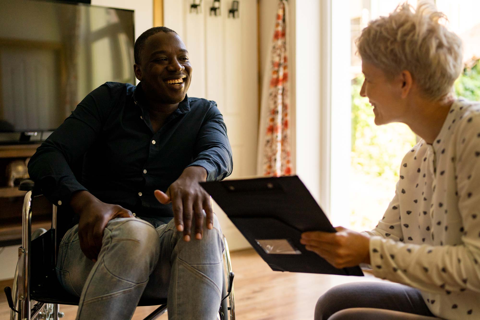 Man in wheelchair meeting woman