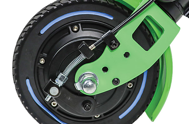 Close-up of the 8-inch motor wheel and disc brake system on a Rehasense ECO Travel LX power add-on.