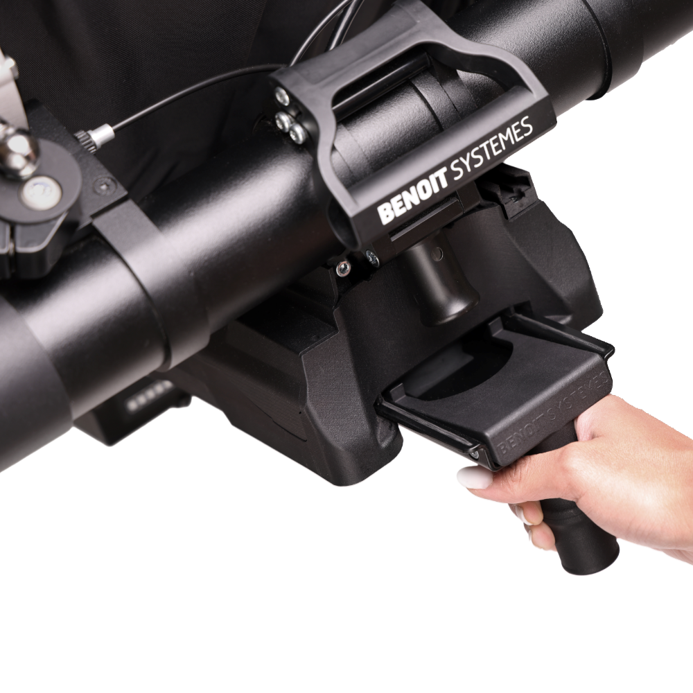 Isolated product view of the Benoit Systèmes Quick-Release Battery, designed for use with the Light Drive wheelchair power add-on, featuring a compact, portable design for easy removal and charging, isolated on a white background.